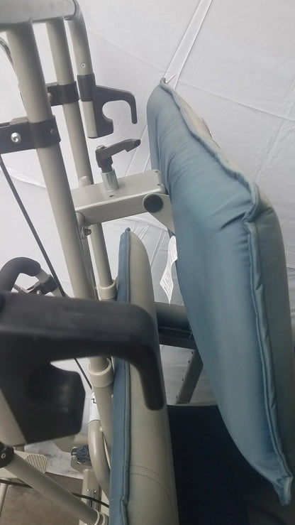 Light blue cushioned backrest attached to medical-grade frame of humanCare i-400 bariatric convertible chair back side