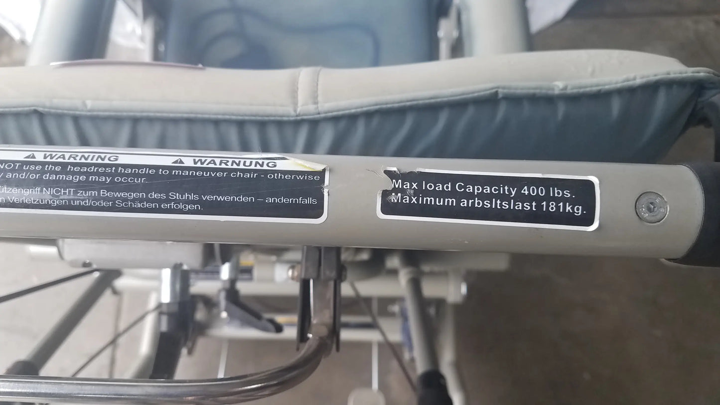 Silver metallic frame with black rubberized grip handle of humanCare i-400 bariatric convertible chair mobility scooter