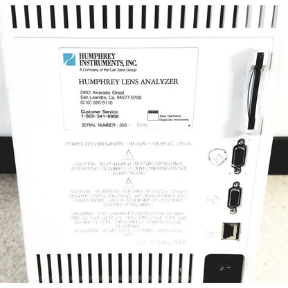 White plastic humphery instruments 350 lens analyzer with black ventilation slits and multiple side ports for reuse medical use