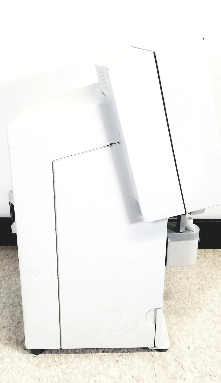 White humphery instruments 350 lens analyzer with angled lid and black caster wheels for reuse medical applications