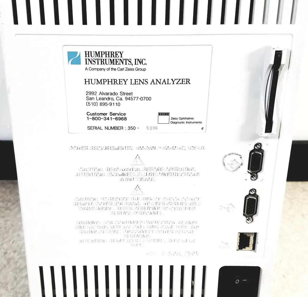White plastic humphery instruments 350 lens analyzer with black ventilation slits and multiple side ports for reuse medical use