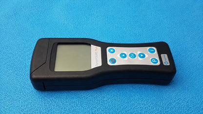 Black handheld Hygiena SystemSURE Plus ATP monitoring device with gray screen and blue circular buttons by Hager