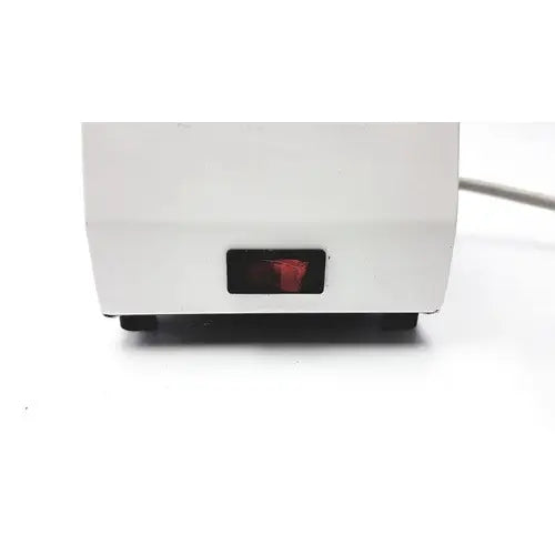 White plastic ideal products ultrasonic gel heater gw108 with red illuminated power indicator light