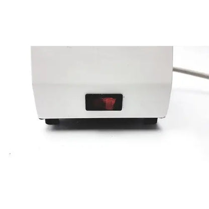 White plastic ideal products ultrasonic gel heater gw108 with red illuminated power indicator light