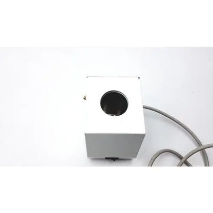 White rectangular ideal products ultrasonic gel heater gw108 with circular opening and gray cable on side