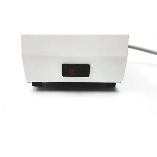 White plastic ideal products ultrasonic gel heater gw108 with a black rectangular power switch on front panel