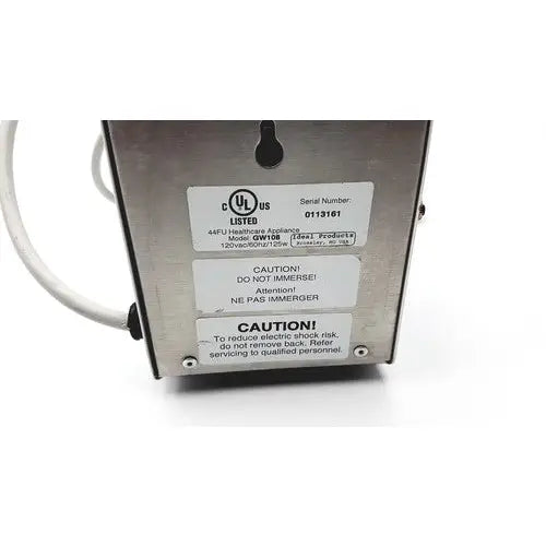 Silver metallic industrial ultrasonic gel heater by ideal products ultrasonic with sturdy design and multilingual safety warnings