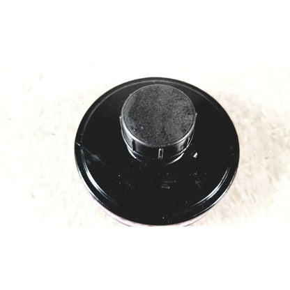 Black plastic ilc dover s-4002 filter with textured circular top and ridged edges for sentinel xl powered air system