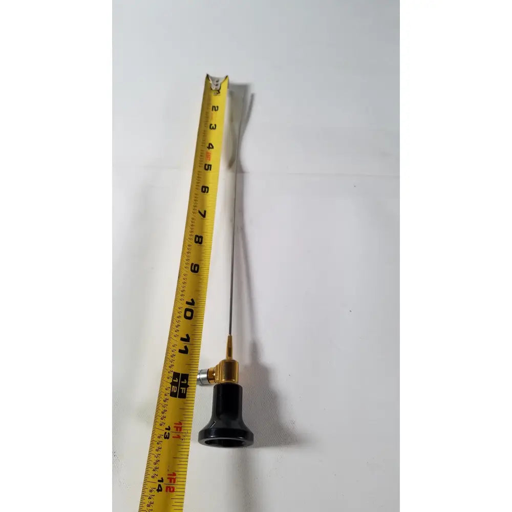 A slender metallic imagyn microlap ml-gold cystoscope with black handle and gold-colored joint for precision use