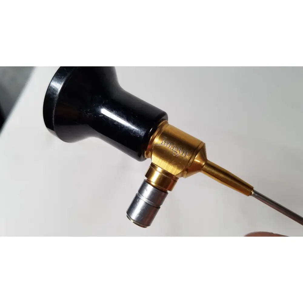 Imagyn microlap ml-gold cystoscope with black and gold body brass-colored joint and silver metallic tip featuring engraved branding