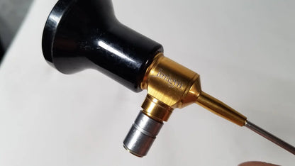 Imagyn microlap ml-gold cystoscope with black and gold body brass-colored joint and silver metallic tip featuring engraved branding