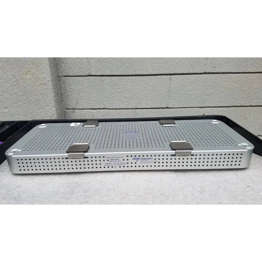Silver perforated metal imp innovative medical mayo knee positioner base tray with three latches and engraved branding