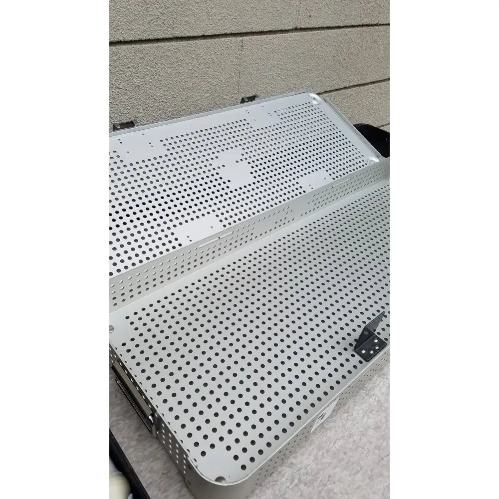 Silver perforated metal knee positioner base tray with reinforced edges by IMP Innovative Medical for Mayo knee positioner