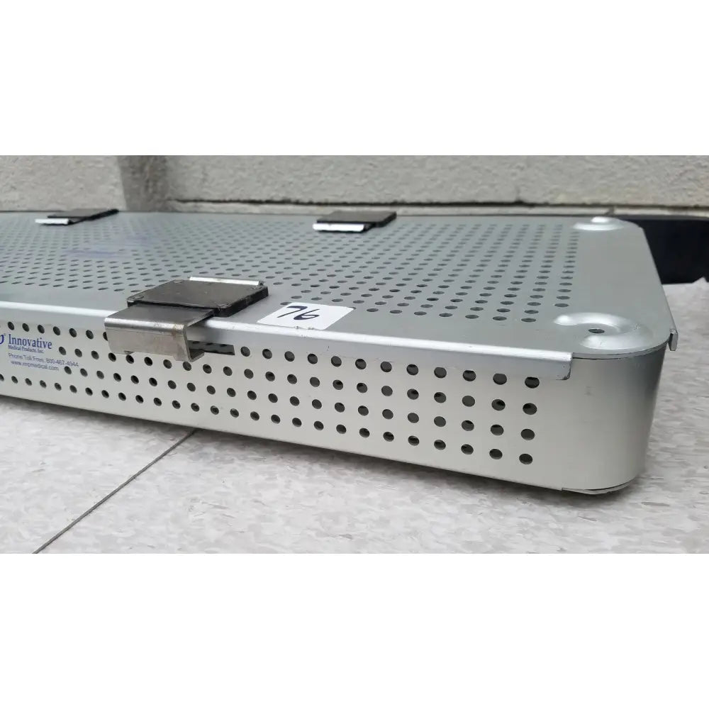 Silver perforated metal imp innovative medical mayo knee positioner base tray with locking clasp and stamped branding