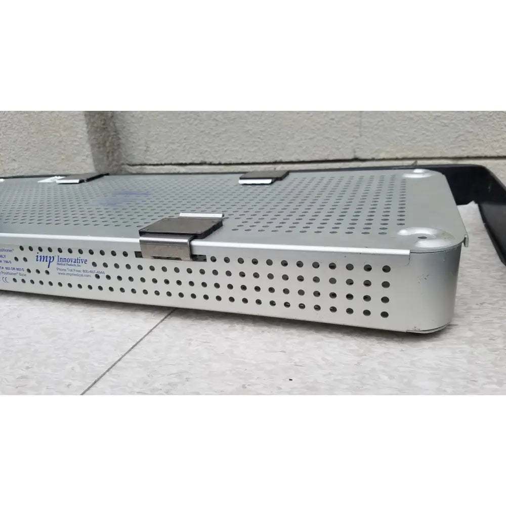 Silver perforated metal imp innovative medical mayo knee positioner base tray with hinged lid and brand name printed on side
