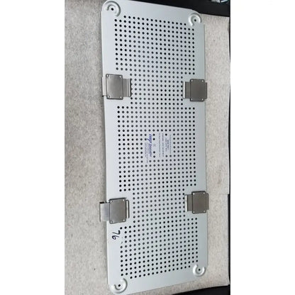 Silver perforated metal tray with four corner latches and label for imp innovative medical mayo knee positioner base tray