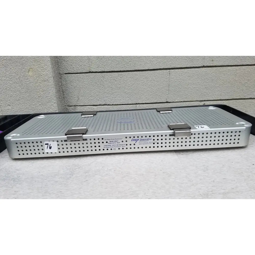 Silver metallic imp innovative medical 706-s mayo knee positioner base tray with perforated surface and two latches on top