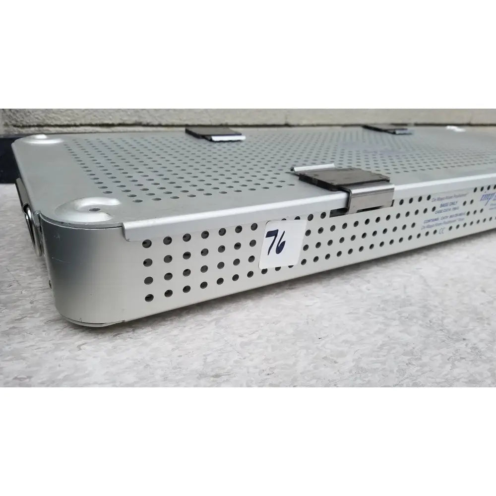 Silver perforated metal surgical instrument tray with label 76 from imp innovative medical mayo knee positioner base tray
