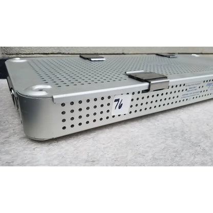 Silver perforated metal surgical instrument tray with label 76 from imp innovative medical mayo knee positioner base tray