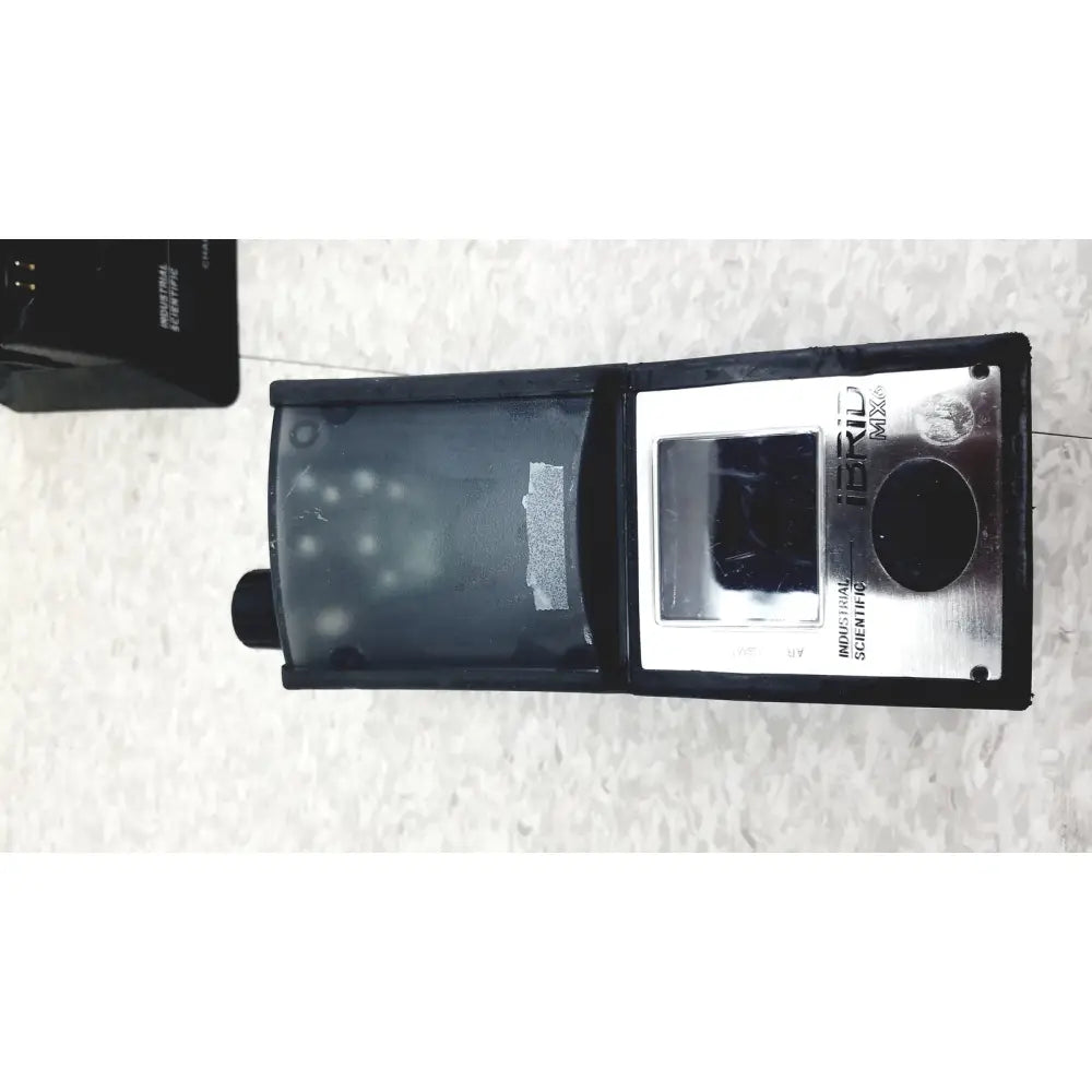 Black and silver industrial scientific mx6 ibrid handheld multi-gas monitor with rectangular display and metallic ibrid mix panel