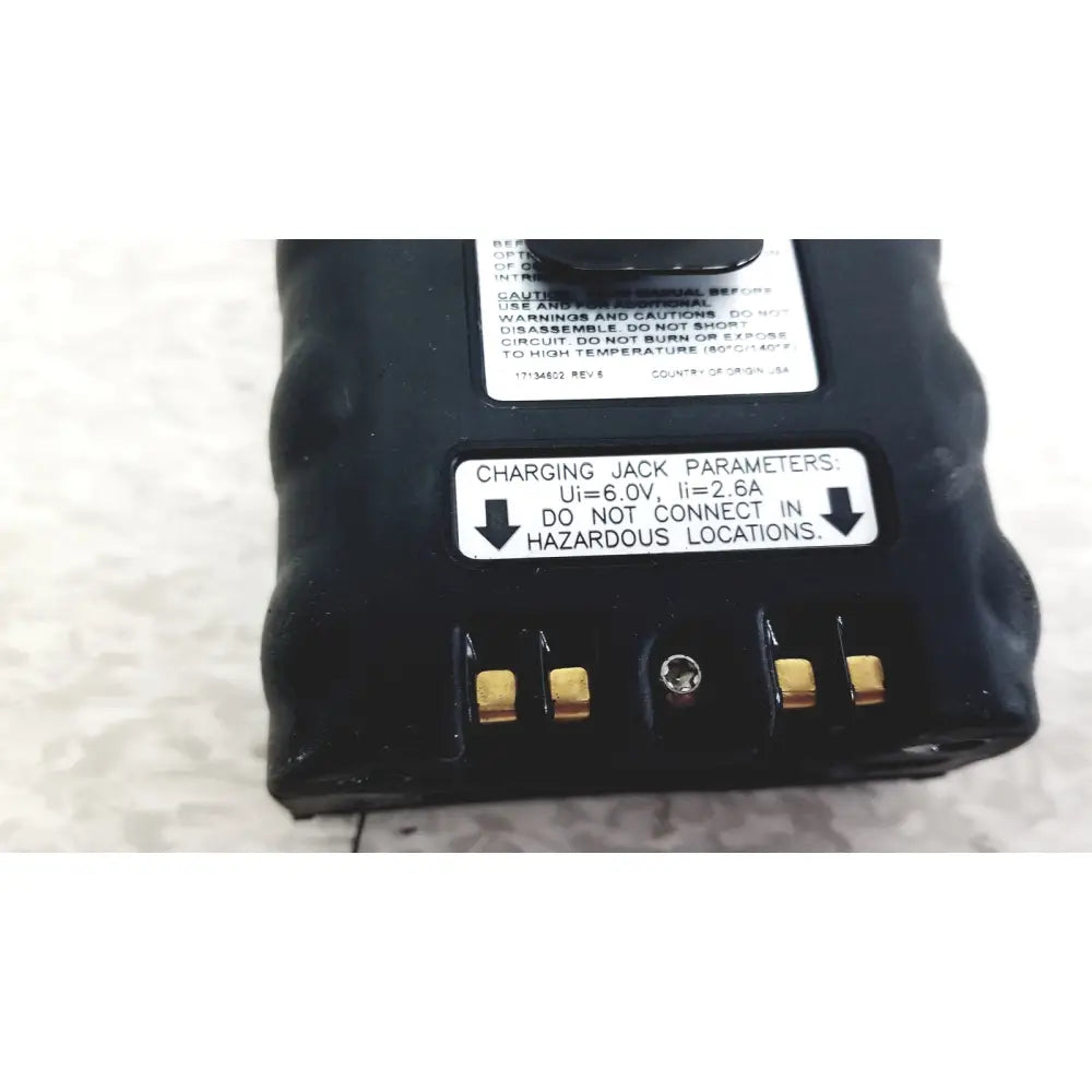 Black plastic industrial scientific mx6 battery with gold charging contacts and white warning labels for mx6 ibrid handheld monitor