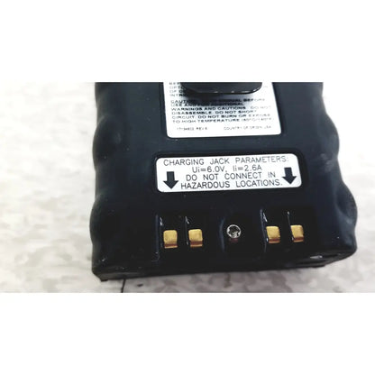 Black plastic industrial scientific mx6 battery with gold charging contacts and white warning labels for mx6 ibrid handheld monitor