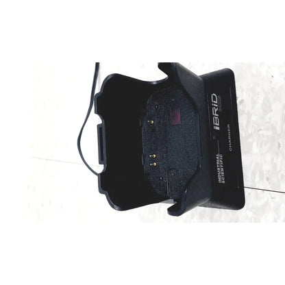 Black plastic industrial scientific mx6 ibrid charger with molded grip and textured interior for handheld use