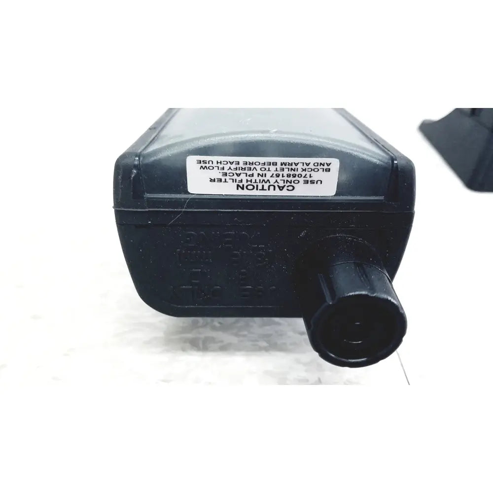 Black plastic air filter housing with textured knob and caution label on industrial scientific mx6 ibrid handheld gas monitor back side