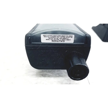 Black plastic air filter housing with textured knob and caution label on industrial scientific mx6 ibrid handheld gas monitor back side