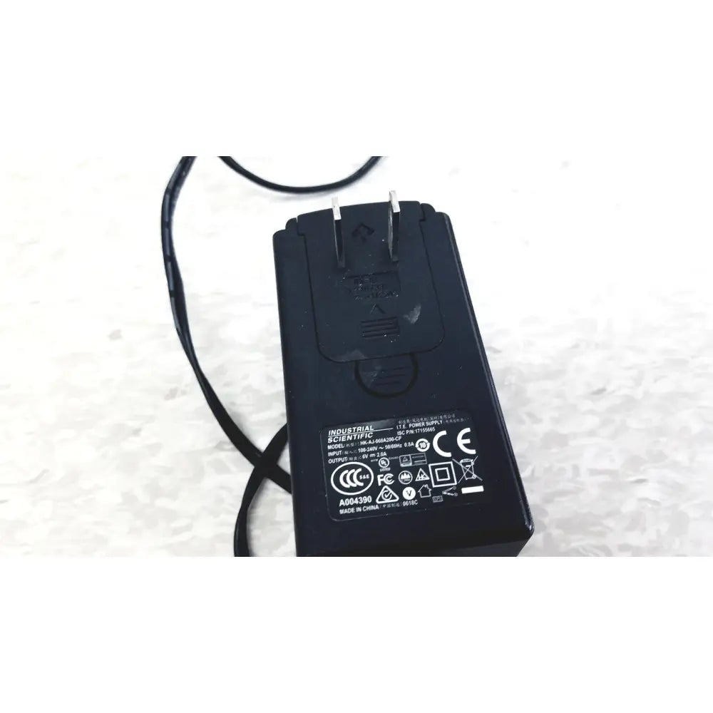 Black plastic power adapter with coiled cable and two-prong plug for industrial scientific mx6 ibrid handheld charger