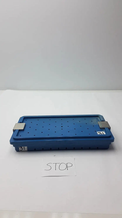 Blue plastic instrument set case with perforated surface and metallic latches for case container sterilization storage