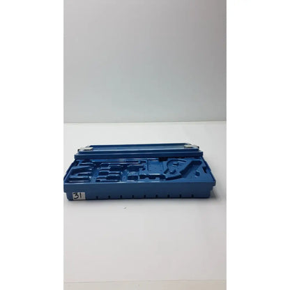 Blue plastic instrument set case container with molded compartments and numbered label for case container sterilization storage