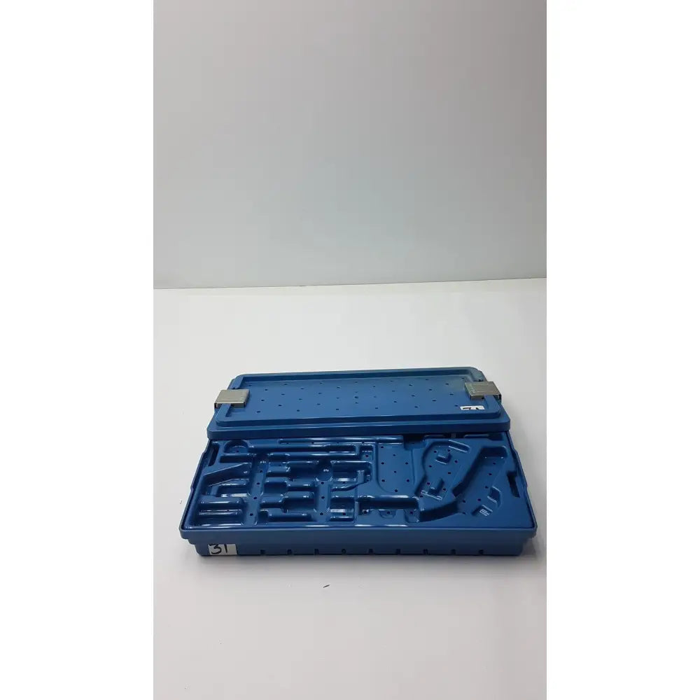 Blue plastic instrument set case container with molded compartments and metallic latches for sterilization storage tray