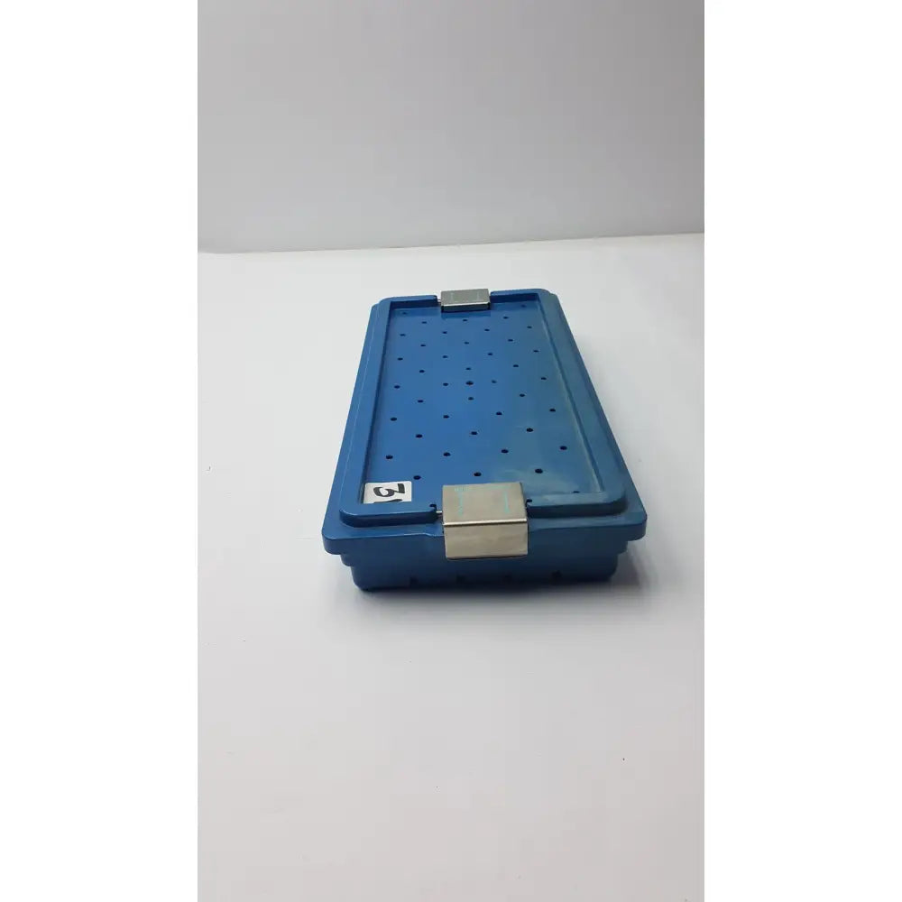 Blue plastic instrument set case container with silver metal latches and perforated design for case container sterilization
