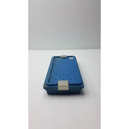 Blue plastic instrument set case container with silver metal latches and perforations for sterilization storage