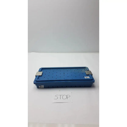 Blue plastic instrument set case with perforated surface and metallic latches for case container sterilization storage
