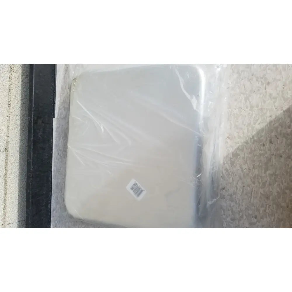 Beige solid instrument tray 13-7/8 x 12-7/8 x 2-1/2 inches wrapped in plastic for reuse medical sterilization trays