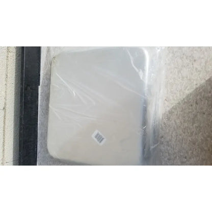 Beige solid instrument tray 13-7/8 x 12-7/8 x 2-1/2 inches wrapped in plastic for reuse medical sterilization trays