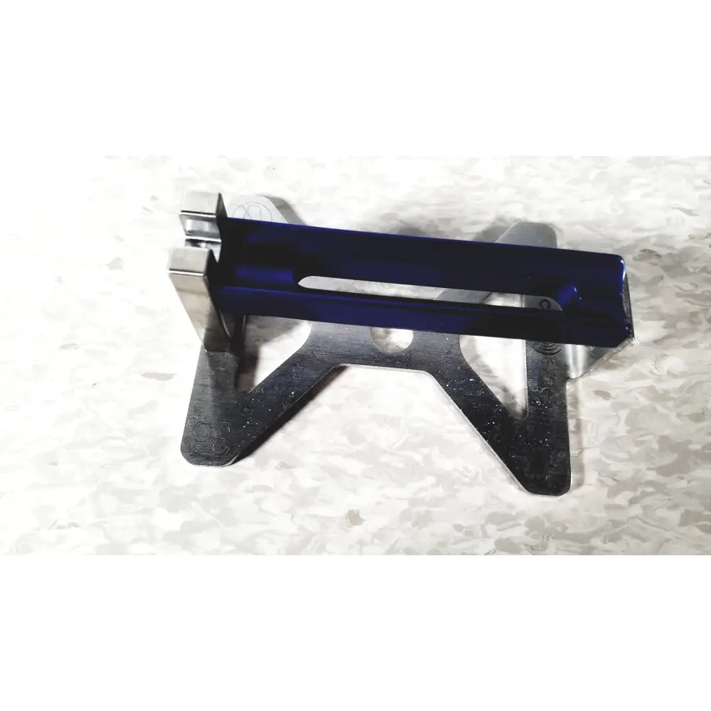 Blue translucent plastic integra cusa excel khz clarity handpiece mounted on silver metal stand for ultrasonic surgery