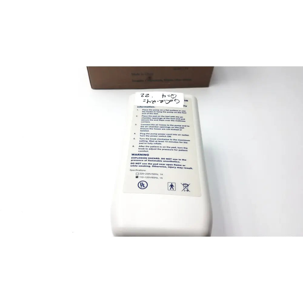 White instruction label with black text and handwritten note on the back of invacare alternating pressure pump cg9701 air mattress