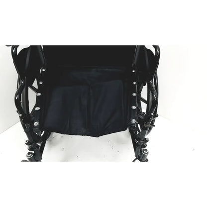 Black Invacare Tracer SX5 manual wheelchair with padded seat and metallic frame for adult standard folding use
