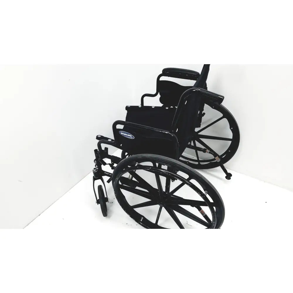Black metal invacare tracer sx5 manual wheelchair with padded seat and backrest for adults standard folding use