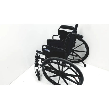 Black metal invacare tracer sx5 manual wheelchair with padded seat and backrest for adults standard folding use