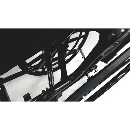 Black metal frame with visible wheel spokes of invacare tracer sx5 manual wheelchair for adults standard folding model