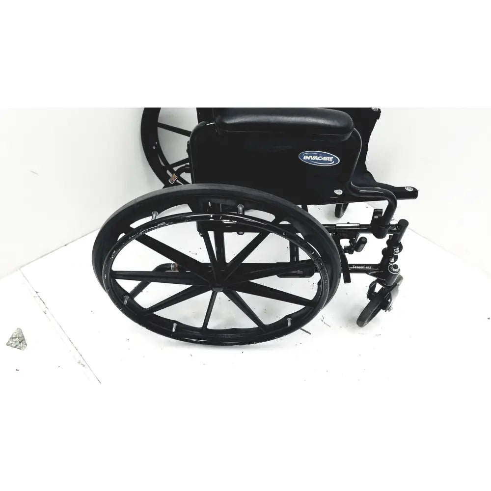 Black Invacare Tracer SX5 manual wheelchair with sleek design and sturdy metal frame for adults standard folding use