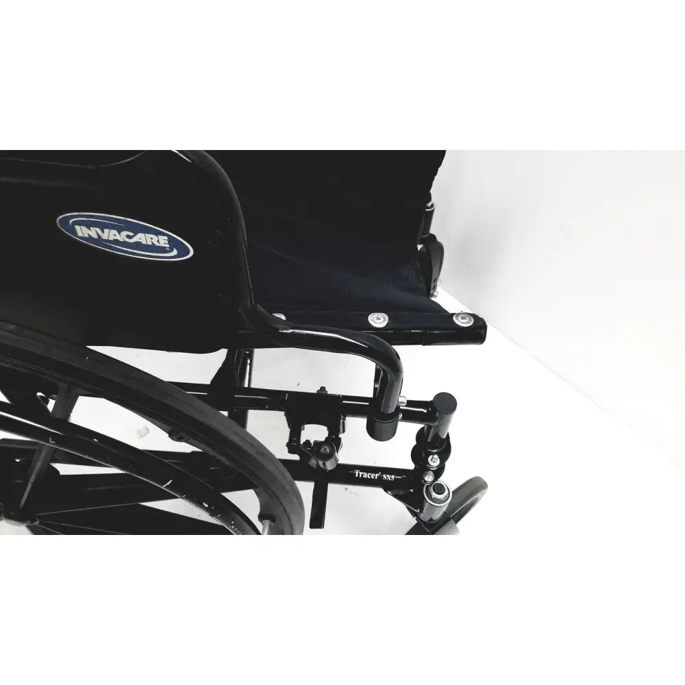 Black invacare tracer sx5 manual wheelchair with sleek modern design and sturdy metal frame for adult use