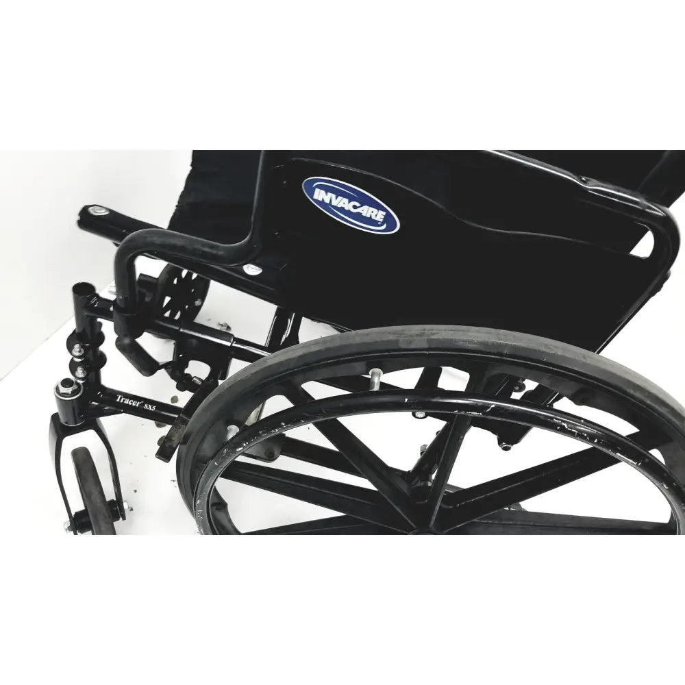 Invacare tracer sx5 manual wheelchair in black with chrome metal frame and large durable rubber tires for adults standard folding