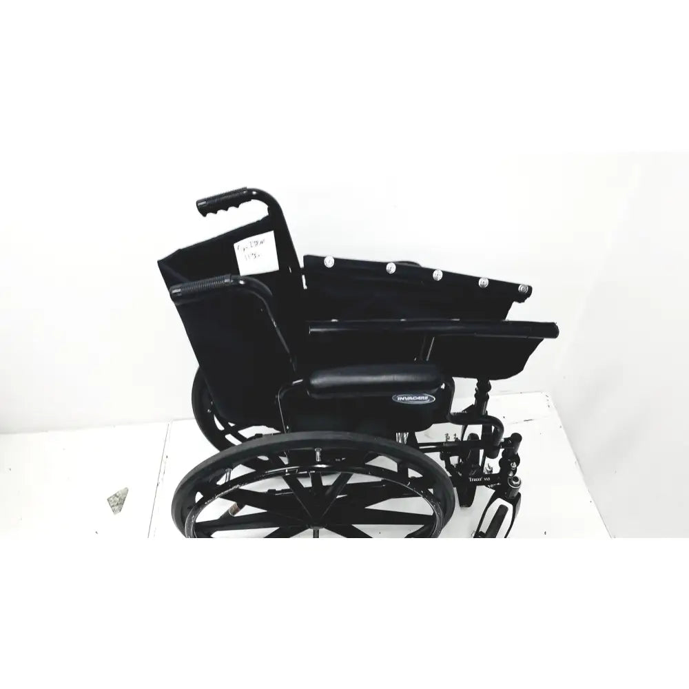 Black metal invacare tracer sx5 manual wheelchair with padded seat and sturdy frame for adult use