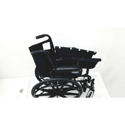 Black metal invacare tracer sx5 manual wheelchair with padded seat and sturdy frame for adult use