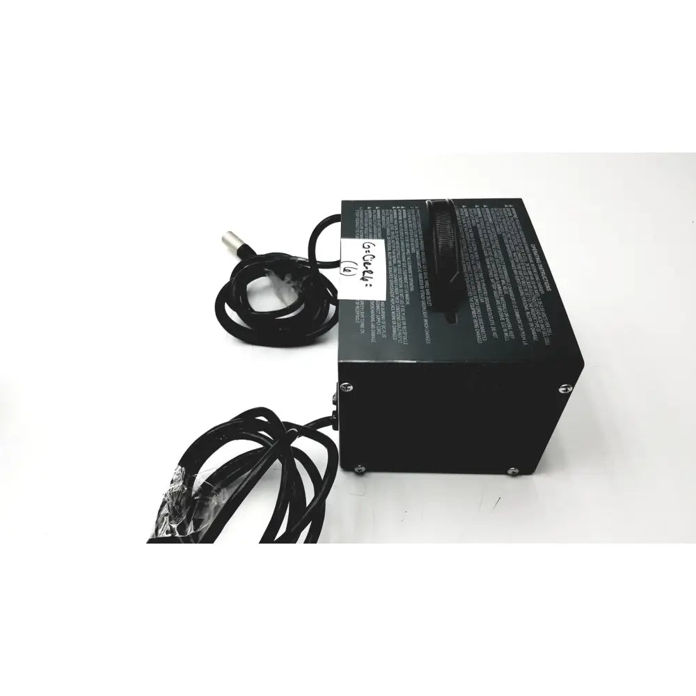 Black rectangular invacare wheelchair 24 volt automatic battery charger with coiled cables and white side label
